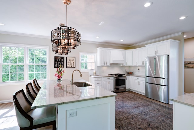 9154 Sargent Manor Ct, Indianapolis, IN 46256 - kitchen featuring appliances with stainless steel finishes, a sink, a chandelier, ornamental molding, and recessed lighting