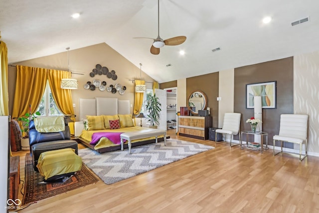 6210 Mckinley Ct, Indianapolis, IN 46220 - living area with ceiling fan, wood finished floors, high vaulted ceiling, and baseboards