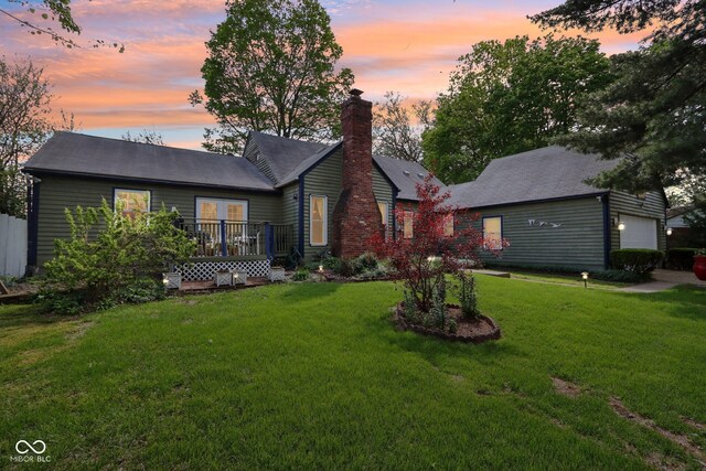 6210 Mckinley Ct, Indianapolis, IN 46220 - view of front of property featuring a front lawn, a chimney, and a deck