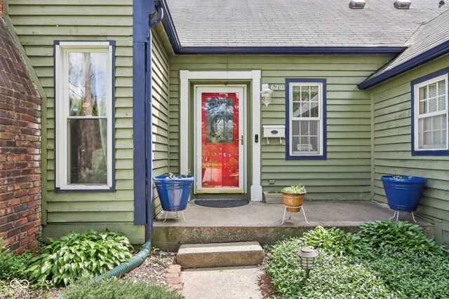 6210 Mckinley Ct, Indianapolis, IN 46220 - doorway to property with roof with shingles