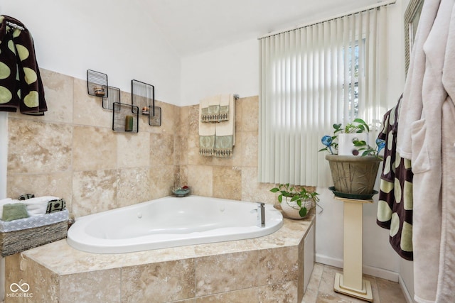 6210 Mckinley Ct, Indianapolis, IN 46220 - bathroom featuring a garden tub and tile walls