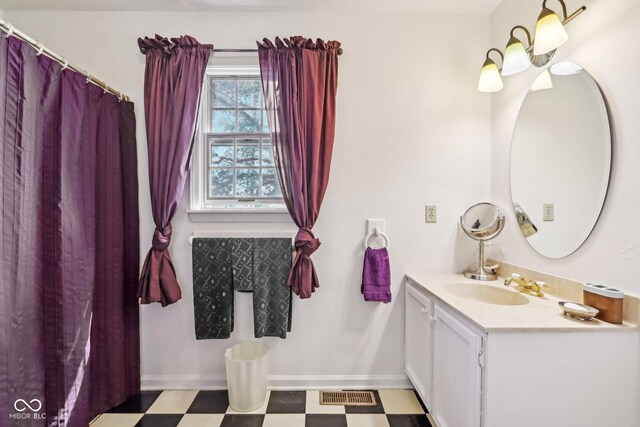 6210 Mckinley Ct, Indianapolis, IN 46220 - bathroom featuring tile patterned floors, vanity, and baseboards