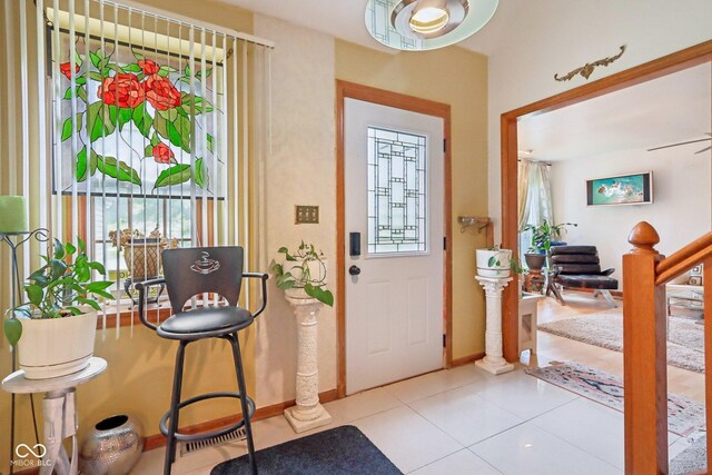 6210 Mckinley Ct, Indianapolis, IN 46220 - tiled foyer entrance featuring baseboards