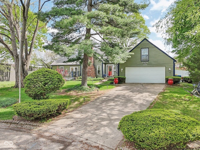 6210 Mckinley Ct, Indianapolis, IN 46220 - view of front of house with an attached garage, concrete driveway, and a front yard