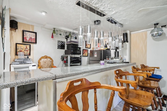 6210 Mckinley Ct, Indianapolis, IN 46220 - bar area with freestanding refrigerator, beverage cooler, and a textured ceiling