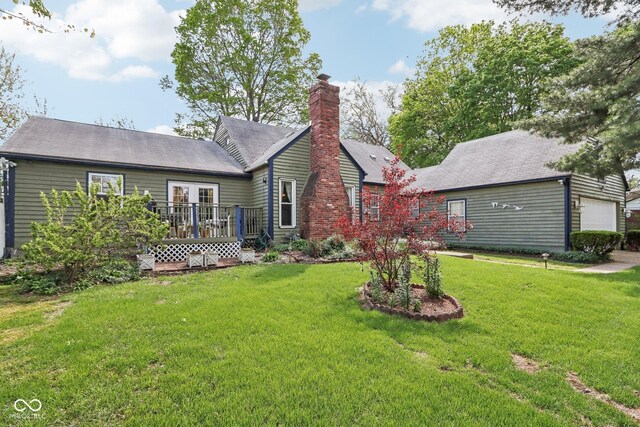 6210 Mckinley Ct, Indianapolis, IN 46220 - back of property with a deck, a yard, and a chimney