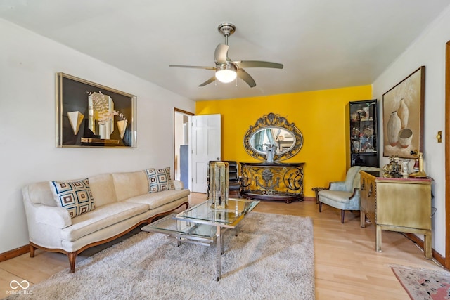 6210 Mckinley Ct, Indianapolis, IN 46220 - living room featuring wood finished floors, a ceiling fan, and baseboards