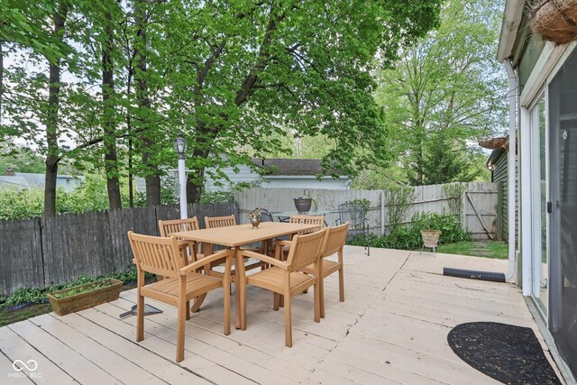 6210 Mckinley Ct, Indianapolis, IN 46220 - wooden deck featuring a fenced backyard and outdoor dining area