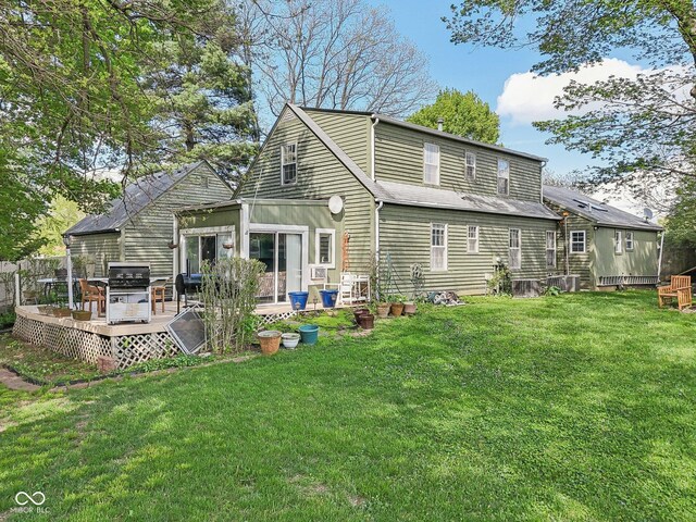 6210 Mckinley Ct, Indianapolis, IN 46220 - rear view of house featuring a deck and a yard