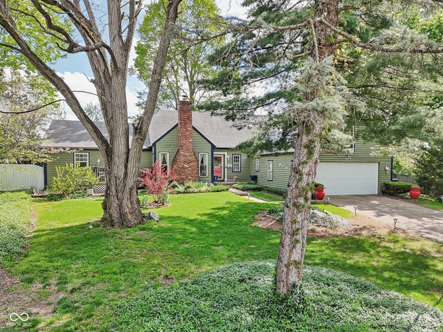6210 Mckinley Ct, Indianapolis, IN 46220 - view of front of property with driveway, a chimney, and a front yard