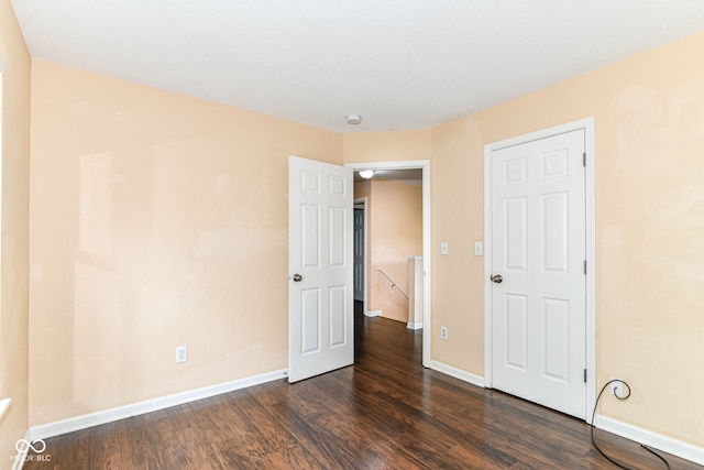 15411 Wandering Way, Noblesville, IN 46060 - unfurnished bedroom featuring dark wood finished floors and baseboards