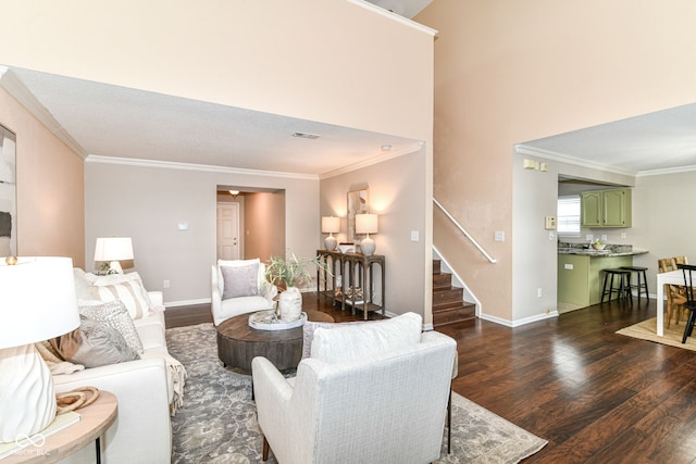15411 Wandering Way, Noblesville, IN 46060 - living area featuring dark wood finished floors, stairs, ornamental molding, and baseboards
