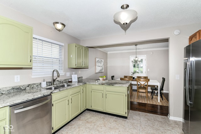 15411 Wandering Way, Noblesville, IN 46060 - kitchen featuring green cabinets, a sink, stainless steel appliances, a peninsula, and ornamental molding