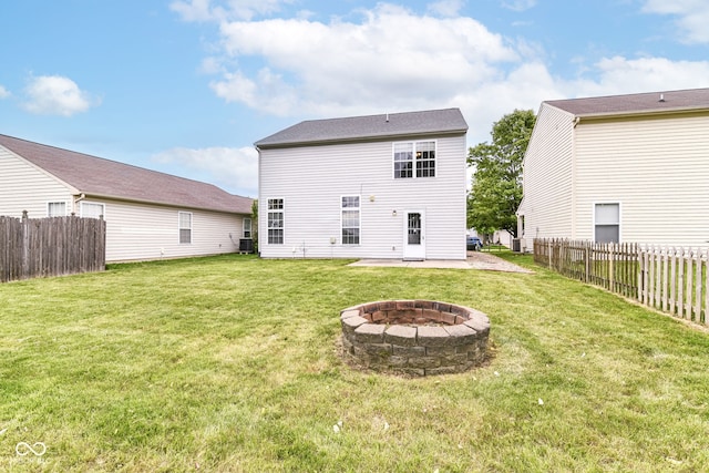 15411 Wandering Way, Noblesville, IN 46060 - back of property featuring a fire pit and a patio area