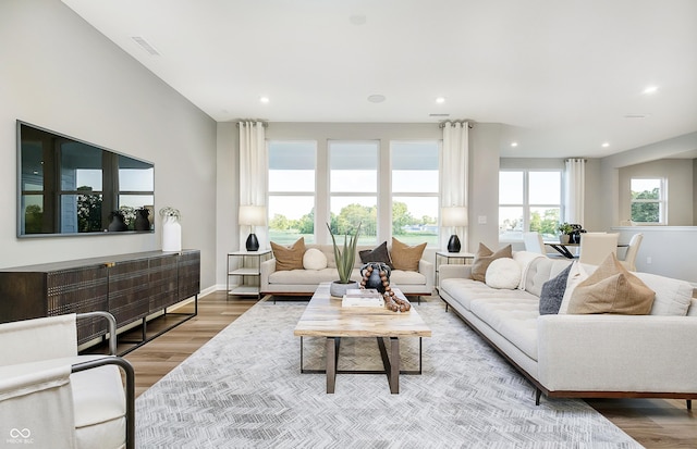 7145 Firestone Rd, Whitestown, IN 46075 - living room featuring wood finished floors, recessed lighting, and baseboards