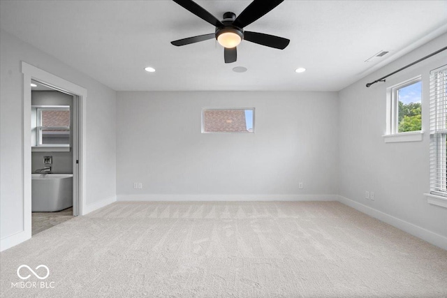2448 Broadway St, Indianapolis, IN 46205 - unfurnished room featuring light colored carpet, baseboards, recessed lighting, and a ceiling fan