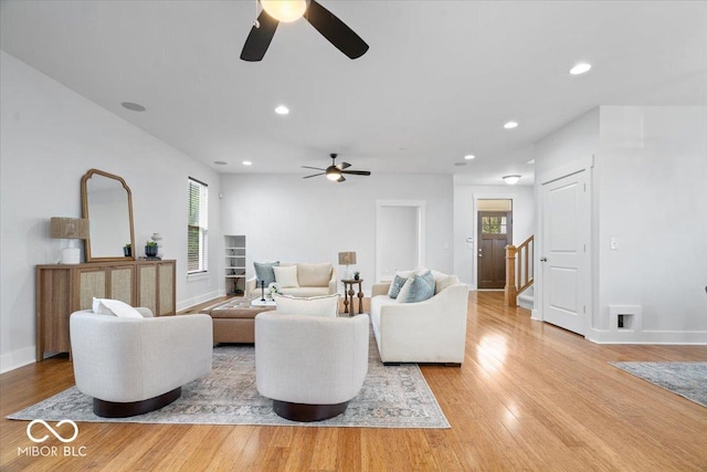 2448 Broadway St, Indianapolis, IN 46205 - living room featuring a ceiling fan, light wood finished floors, stairway, and recessed lighting