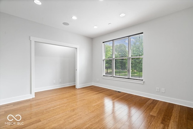2448 Broadway St, Indianapolis, IN 46205 - unfurnished bedroom with baseboards, light wood-style floors, and recessed lighting
