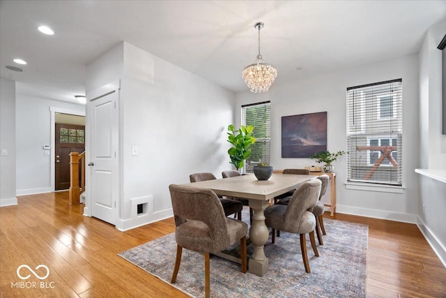 2448 Broadway St, Indianapolis, IN 46205 - dining area featuring a chandelier, light wood-style floors, baseboards, healthy amount of natural light, and recessed lighting