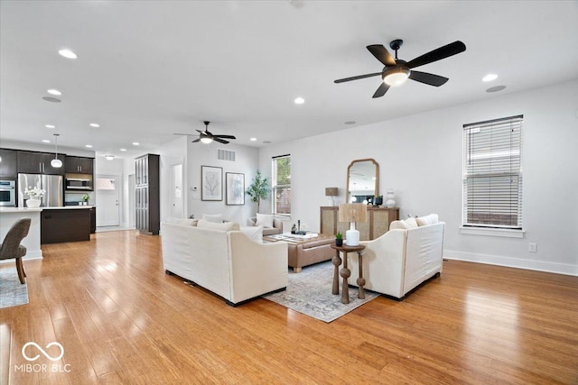 2448 Broadway St, Indianapolis, IN 46205 - living area with a ceiling fan, light wood-style flooring, recessed lighting, and baseboards