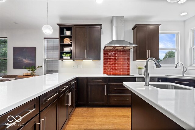 2448 Broadway St, Indianapolis, IN 46205 - kitchen with wall chimney exhaust hood, light countertops, black electric cooktop, and recessed lighting