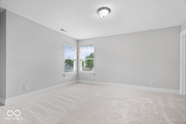 2448 Broadway St, Indianapolis, IN 46205 - carpeted empty room with baseboards