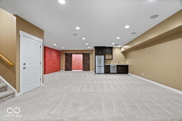 2448 Broadway St, Indianapolis, IN 46205 - unfurnished living room with a barn door, light colored carpet, baseboards, recessed lighting, and stairway