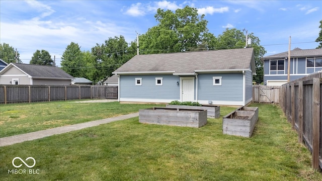 2448 Broadway St, Indianapolis, IN 46205 - back of property featuring a garden and a shingled roof