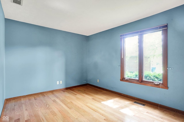 50 Charing Cross Rd, Indianapolis, IN 46217 - empty room featuring plenty of natural light, wood finished floors, and baseboards