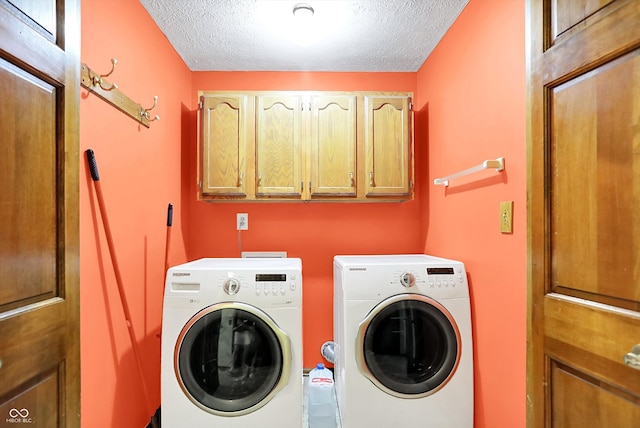 50 Charing Cross Rd, Indianapolis, IN 46217 - laundry room featuring cabinet space, independent washer and dryer, and a textured ceiling