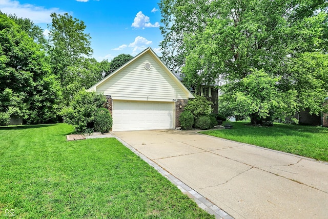 50 Charing Cross Rd, Indianapolis, IN 46217 - view of property exterior featuring driveway, a lawn, brick siding, and a garage