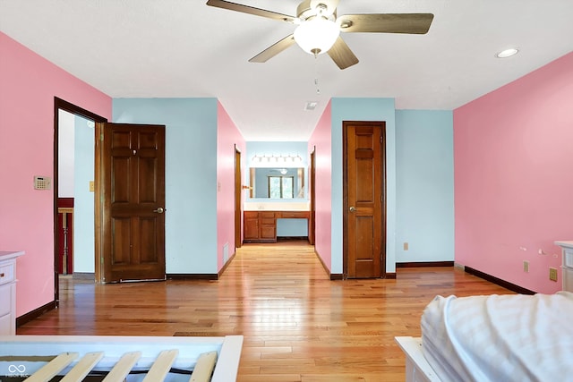 50 Charing Cross Rd, Indianapolis, IN 46217 - bedroom with light wood-style floors, baseboards, ensuite bathroom, and recessed lighting
