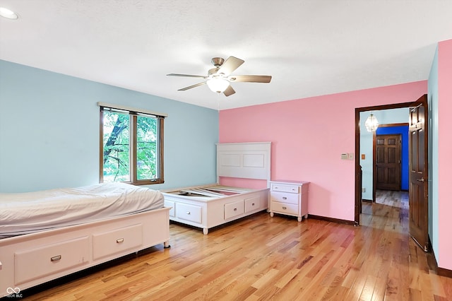 50 Charing Cross Rd, Indianapolis, IN 46217 - bedroom featuring light wood-style floors, ceiling fan, and baseboards