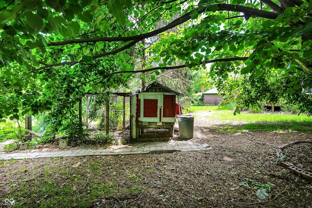50 Charing Cross Rd, Indianapolis, IN 46217 - view of yard with exterior structure and an outbuilding