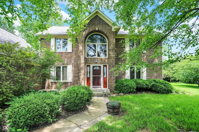 50 Charing Cross Rd, Indianapolis, IN 46217 - view of front facade featuring brick siding and a front lawn