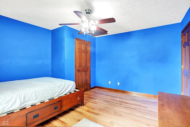 50 Charing Cross Rd, Indianapolis, IN 46217 - bedroom with wood finished floors, baseboards, and ceiling fan