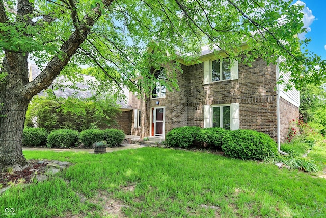 50 Charing Cross Rd, Indianapolis, IN 46217 - view of front of home with brick siding and a front yard