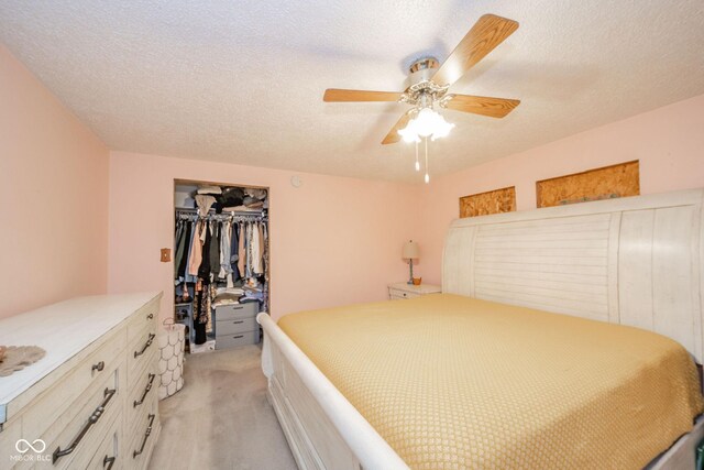 313 S Walnut St, New Castle, IN 47362 - bedroom featuring light carpet, a closet, a textured ceiling, and ceiling fan