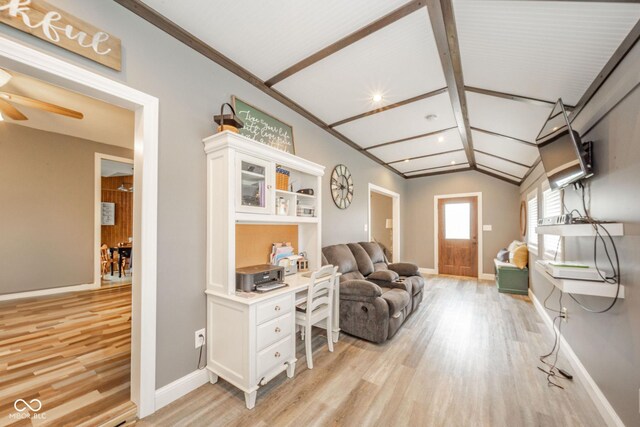 313 S Walnut St, New Castle, IN 47362 - living room featuring light wood-style flooring, lofted ceiling, baseboards, ceiling fan, and a desk