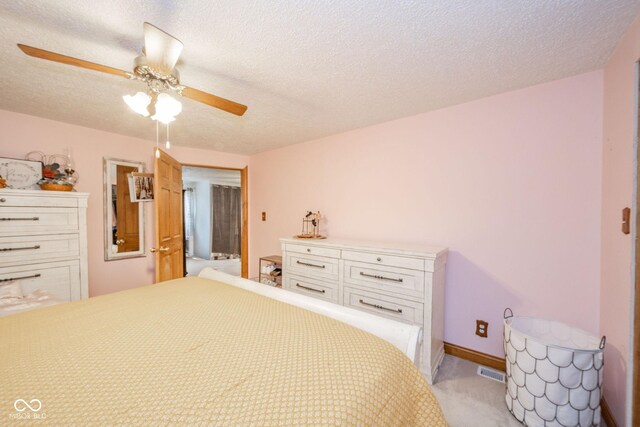 313 S Walnut St, New Castle, IN 47362 - bedroom featuring light carpet, ceiling fan, and a textured ceiling
