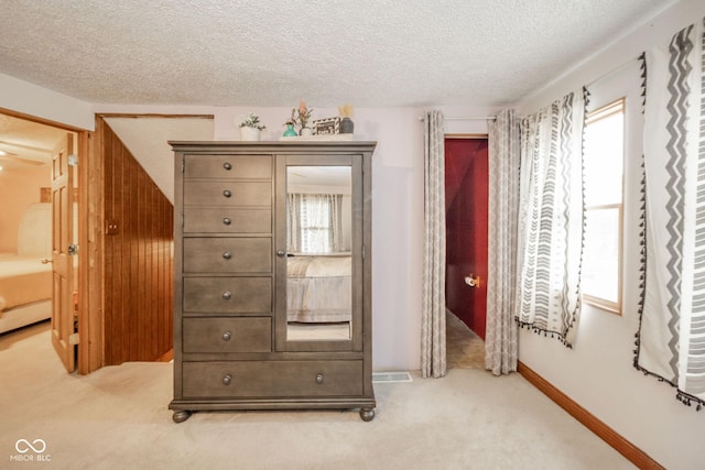 313 S Walnut St, New Castle, IN 47362 - bedroom featuring light colored carpet, a textured ceiling, and baseboards