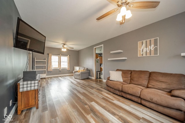 313 S Walnut St, New Castle, IN 47362 - living room featuring ceiling fan, wood finished floors, and baseboards