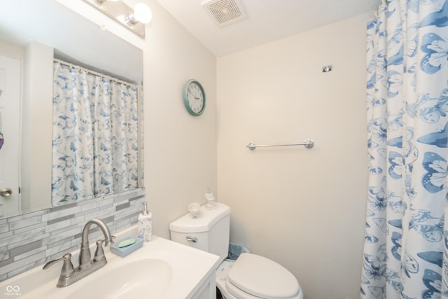 2900 Helms Rd, Anderson, IN 46016 - full bath with tasteful backsplash, toilet, vanity, and curtained shower