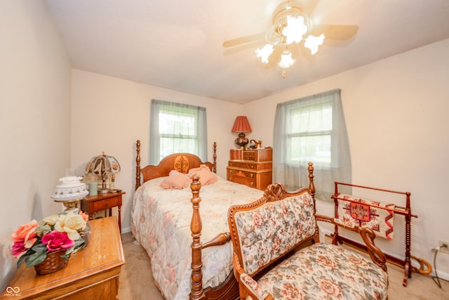 2900 Helms Rd, Anderson, IN 46016 - bedroom featuring light carpet, ceiling fan, and baseboards