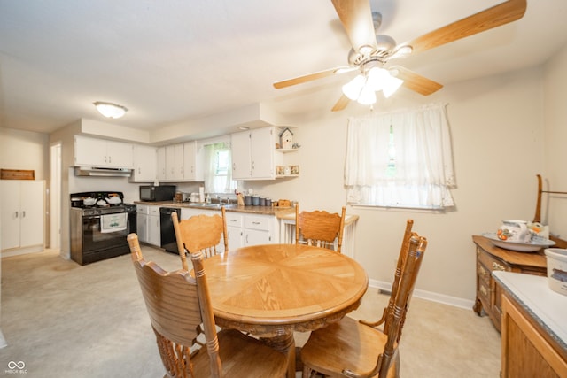 2900 Helms Rd, Anderson, IN 46016 - dining area with light colored carpet, ceiling fan, and baseboards