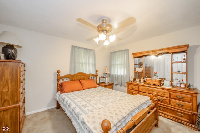 2900 Helms Rd, Anderson, IN 46016 - bedroom with light colored carpet, a ceiling fan, and baseboards
