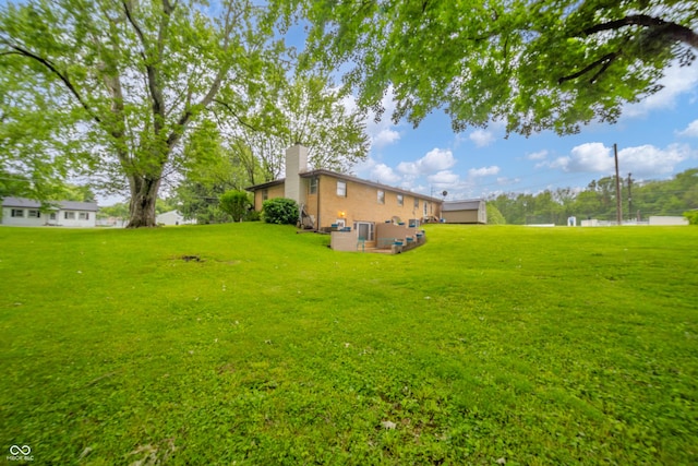 2900 Helms Rd, Anderson, IN 46016 - view of green lawn with an outdoor living space