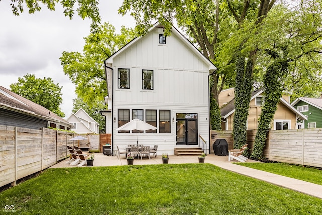 5254 N Park Ave, Indianapolis, IN 46220 - rear view of property with entry steps, board and batten siding, and a patio