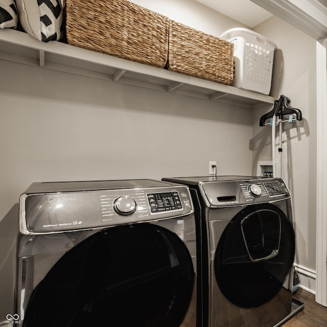 5254 N Park Ave, Indianapolis, IN 46220 - washroom featuring washer and clothes dryer and wood finished floors