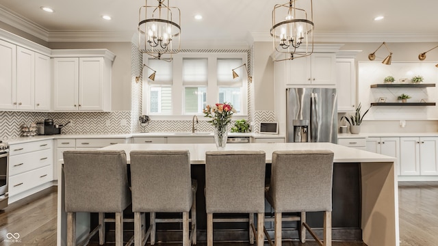5254 N Park Ave, Indianapolis, IN 46220 - kitchen with stainless steel refrigerator with ice dispenser, a sink, a chandelier, light countertops, and recessed lighting